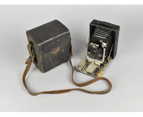 A Vintage Folding Camera with Leather Cased Plate and Negatives 