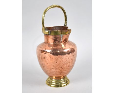 A Vintage Copper and Brass Double Spout Jug with Loop Handle, 21.5cms High 