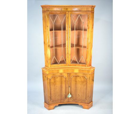 A Modern Yew Wood Inverted Bow Fronted Corner Cabinet, 91cms Wide 
