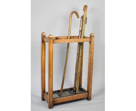 An Edwardian Oak Three Section Stick Stand with Metal Drip Tray and Complete with Three Vintage Rustic Walking Sticks, 45x23x