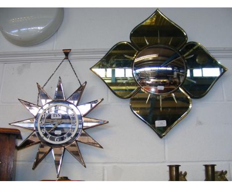A mirrored sunburst wall clock, together with a flower shaped mirror 