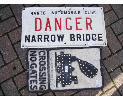 A cast metal railway sign 'Crossing No Gates' together with a 'Danger Narrow Bridge' metal sign for Hants Automobile club