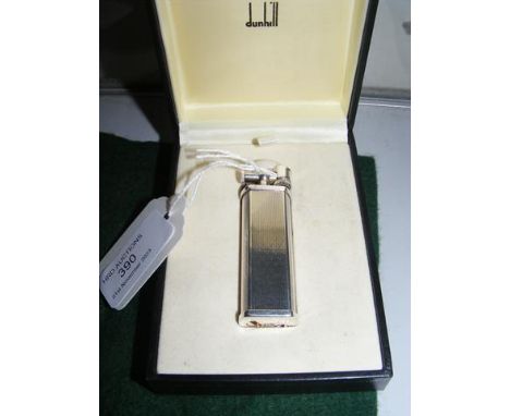 A boxed Dunhill lighter with booklet