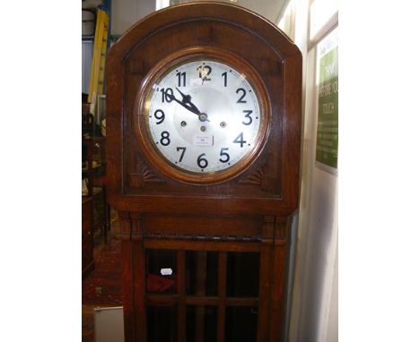 An oak cased Grandmother clock with chiming movement 