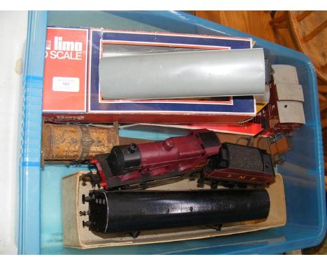 A boxed Lima 0 gauge freight wagon together with others