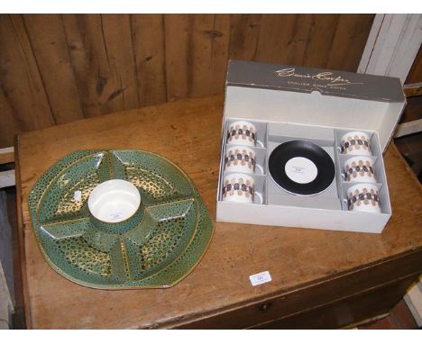 A Poole Pottery hors d'oeuvres dish, together with a boxes Susie Cooper coffee set