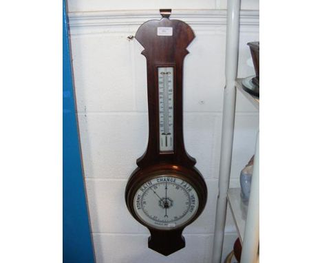 An aneroid barometer and thermometer in wooden case 