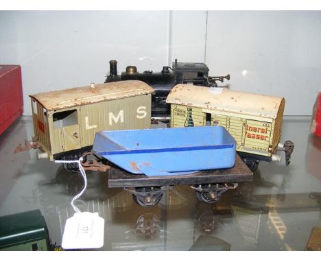 An old Hornby 0 gauge locomotive, together with two wagons and hopper