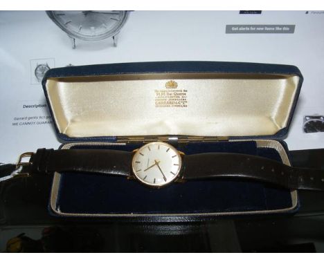 A gents 9ct gold Garrard manual wind wrist watch in original case