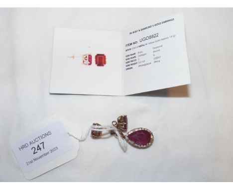 A 9ct ruby and diamond pendant with matching earrings