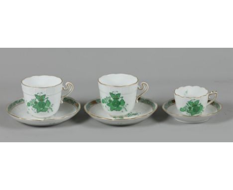 A lot of porcelain cups and saucers, including an espresso, with Apponyi green decor. Herend, late 20th century.