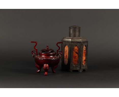 A lot consisting of a pewter tea caddy and a wooden incense burner. China, late 20th century.