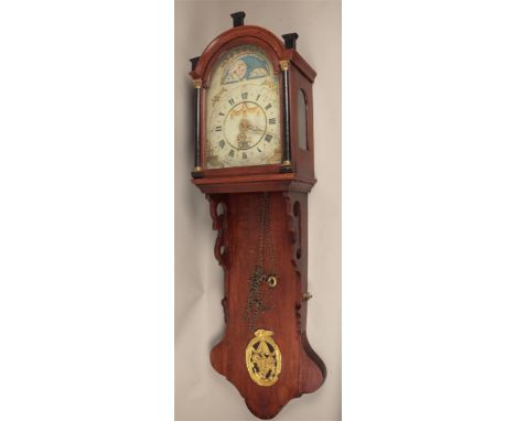 A "Frisian" hanging clock with moon and date indication, and alarm function.H.: 127 cm. excl. poppen.  