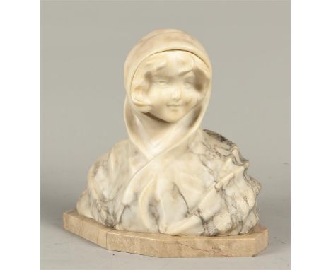 A marble bust of a young girl in a headscarf. Italy, first half of the 20th century.H.: 24,5 cm. 