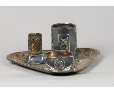 A silver plated Art Noveau smoking set decorated with hunting scenes. Circa 1910.Diam.: 28 cm.