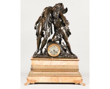 A monumental "Charles X" mantel clock on fire-gilt claw feet and with palm leaf banding. The bell image depicts a classic her