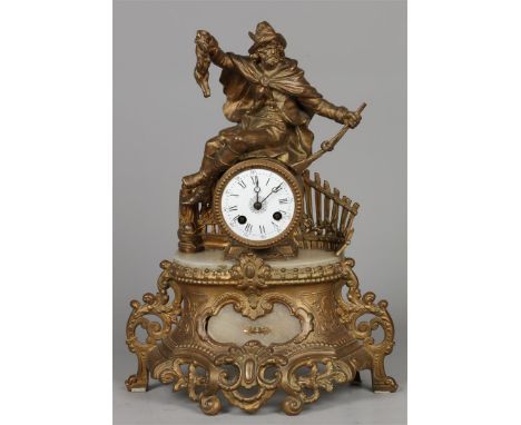 A zamac mantel clock with a hunting scene. France, late 19th century.H.: 40 cm.