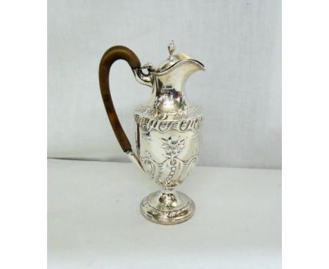 C19th Silver Ewer with fruit wood handle embossed with swirls & bouquets of flowers etc. on circular foot, hinged cover with 