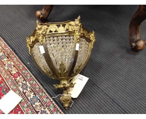 A gilt and lacquered brass hanging ceiling light, with six panels of glass bead decoration
