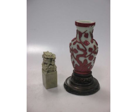 A Pekin type glass vase, 16cm high, on carved wooden stand, 21.5cm high; and a soapstone seal 12cm high