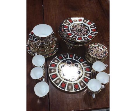 A Royal Crown Derby 1128 pattern imari service for twelve, comprising cups, saucers, six side plate and six larger side plate