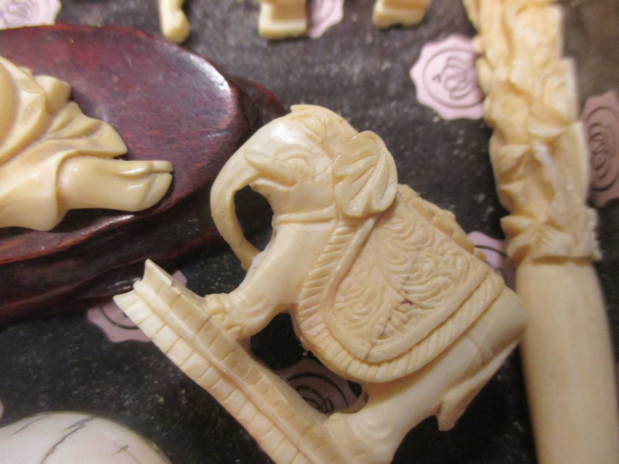 Group of 12 mainly Japanese carved ivory and other objects, in varying