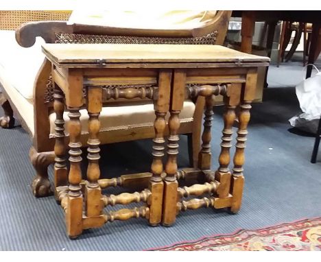 A 17th century style fruitwood small foldover table on vase and bobbin turned supports 52cmx61cmx30cm (closed)