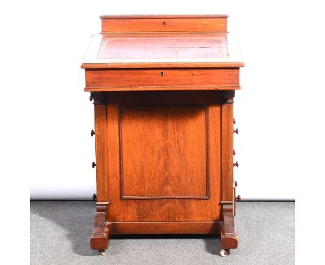 Late Victorian walnut davenport desk, the top with a pen tray above a writing surface, the right side with four drawers oppos