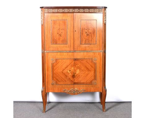 Continental kingwood and inlaid cocktail cabinet, circa 1930, applied gilt metal frieze, the pair of doors inlaid with floral