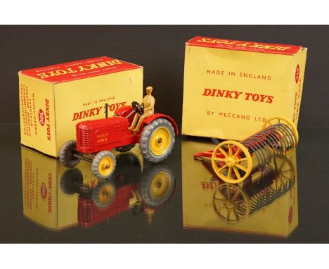Boxed Dinky 300 Massey Harris Tractor diecast model in red with driver, plus a boxed Dinky 324 Hay Rake, diecast vg, boxes gd