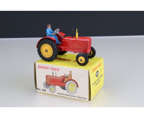 Boxed Dinky No 300 Massey Ferguson Tractor diecast model in red, with driver, diecast ex, box gd with some foxing 