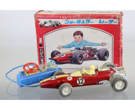 Boxed Bandai Japan R/C 7-7579 Battery Operated tin plate racing car with driver, in red, race number 12, complete, car is goo