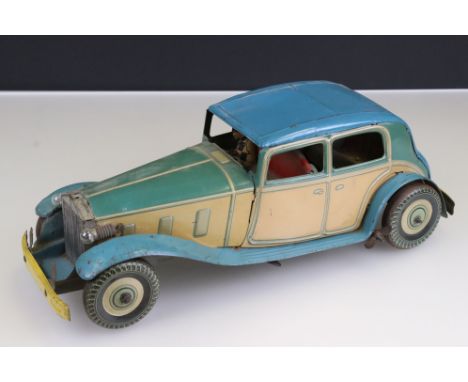 Clockwork tin plate 'made in England' Rolls Royce with chauffeur model, missing mascot, some discolouring and wear, in blue a