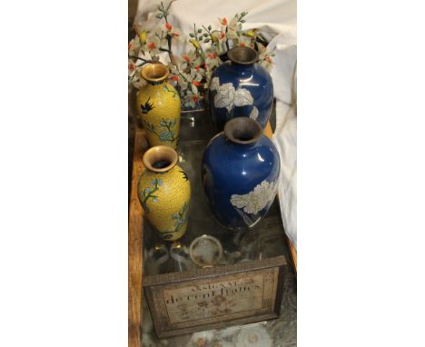 A pair of cloisonne enamel vases with a blue ground decorated with flowers together with a pair of yellow ground cloisonne en