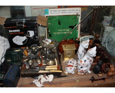 Assorted flatwares together with pottery cats, brass carriage clock, records etc