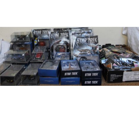 A collection of batman models, Star trek models, Star Trek magazines and assorted fridge magnets etc