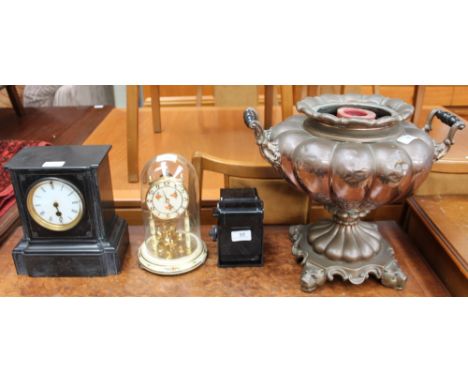 A black slate mantle clock together with an anniversary clock, a copper samovar, and a Rondiflex camera