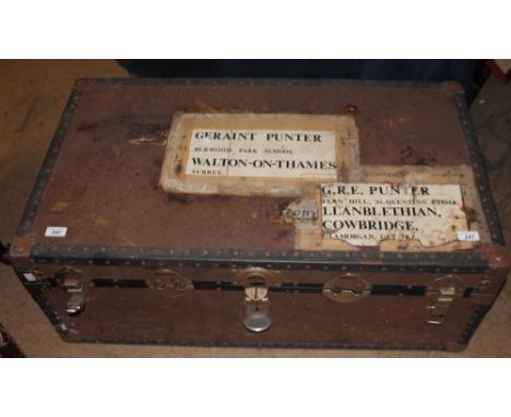 A trunk containing a croquet set together with a camp stove etc