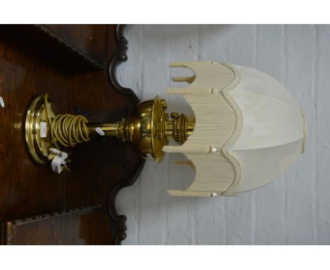 Brass oil lamp, converted to a table lamp, circular base complete with shade, 68cm.