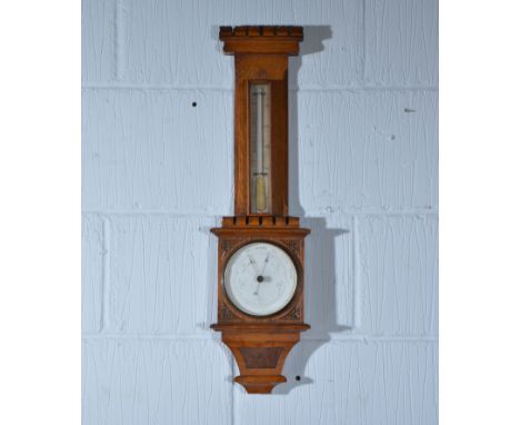 Late Victorian oak aneroid barometer, castellated top with thermometer over, 67cm.