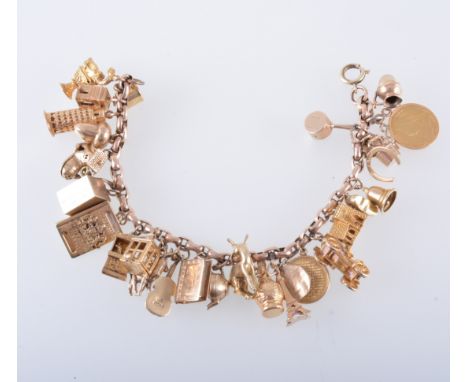 A charm bracelet with charms, a rose metal oval belcher link chain bracelet with twenty eight charms attached, mostly hallmar