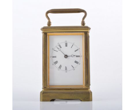 French brass cased carriage clock, white enamelled dial, platform escapement, striking on a gong, 14cm.