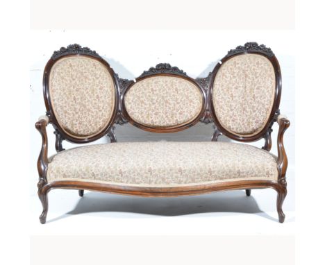 Victorian rosewood five-piece salon suite, floral pattern upholstery, comprising a three panelled back sofa with foliate cres