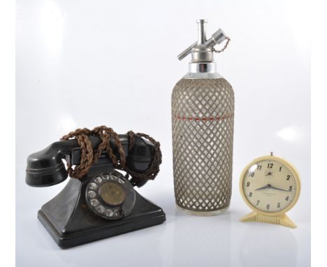 Vintage soda syphon, pair of cast metal cannons, black telephone, cameras, games etc, two boxes.