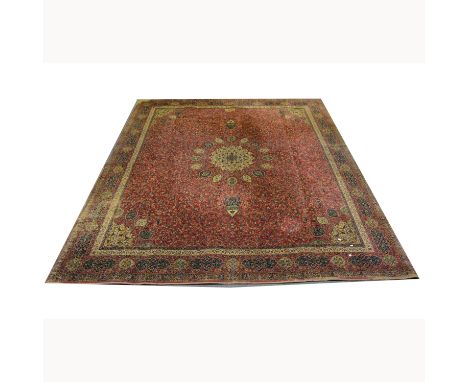 A large carpet, near square, red ground with central medallion, approx 365 x 323cm.