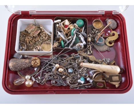 A collection of vintage jewellery, chains, cufflinks, rings, pendants, hatpins, a 10/- note charm in a 9 carat gold frame, a 