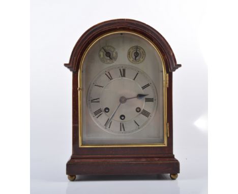 Stained wood mantel clock, silvered arched dial with Roman numeral chapter ring, height 30cm.