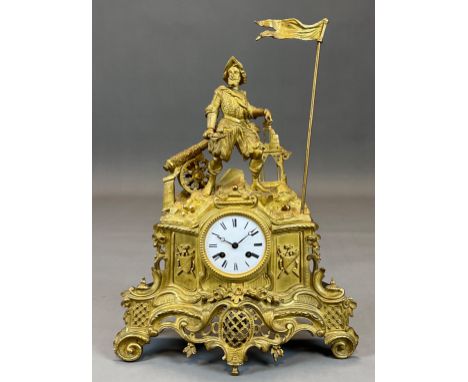 Kaminuhr mit Darstellung des Vasco da Gama. Um 1900.Circa 48 cm x 35 cm x 13 cm. Messing feuervergoldet. Emaille-Zifferblatt 