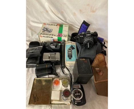 1 box of assorted cameras, Box brownie 2, Minolta X700, Cobra flash unit, Minolta ve(tis 20 Minolta AFE11, Olympus trip Junio