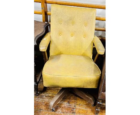 A mid 20th century leather swivel armchair, curved button back, tapered armrests, raised on a X frame supports on castors. (A